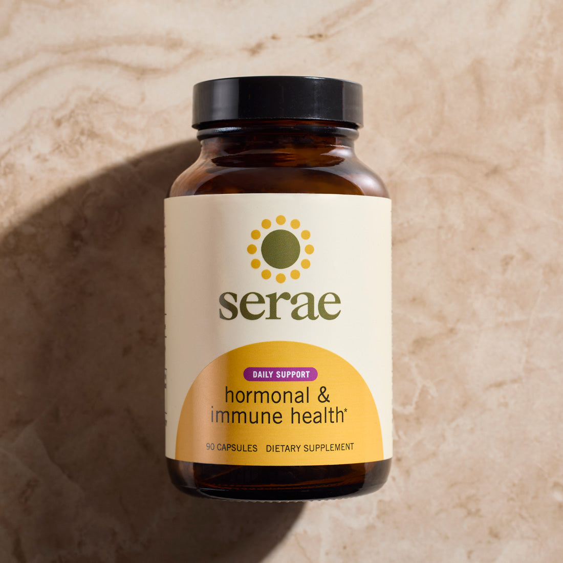 Woman taking Serae daily hormone balance and immune support supplement